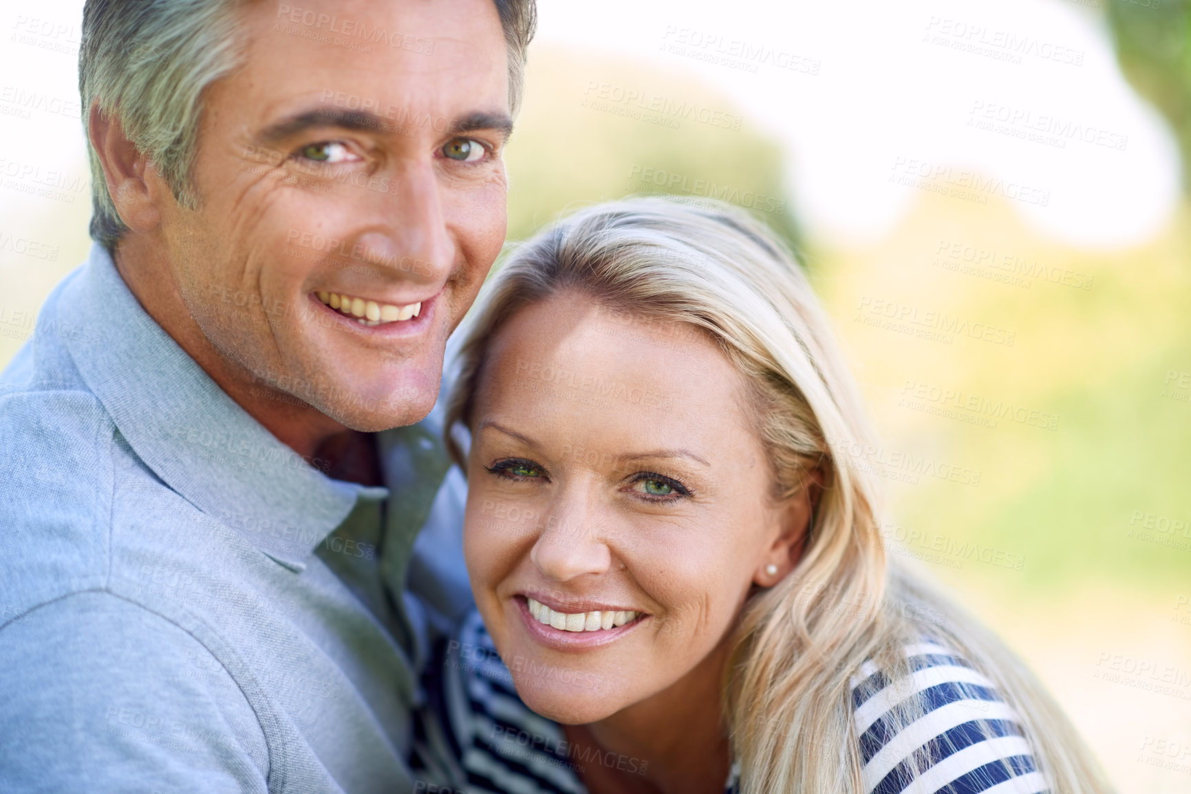 Buy stock photo Cropped portrait of an affectionate mature couple in the park