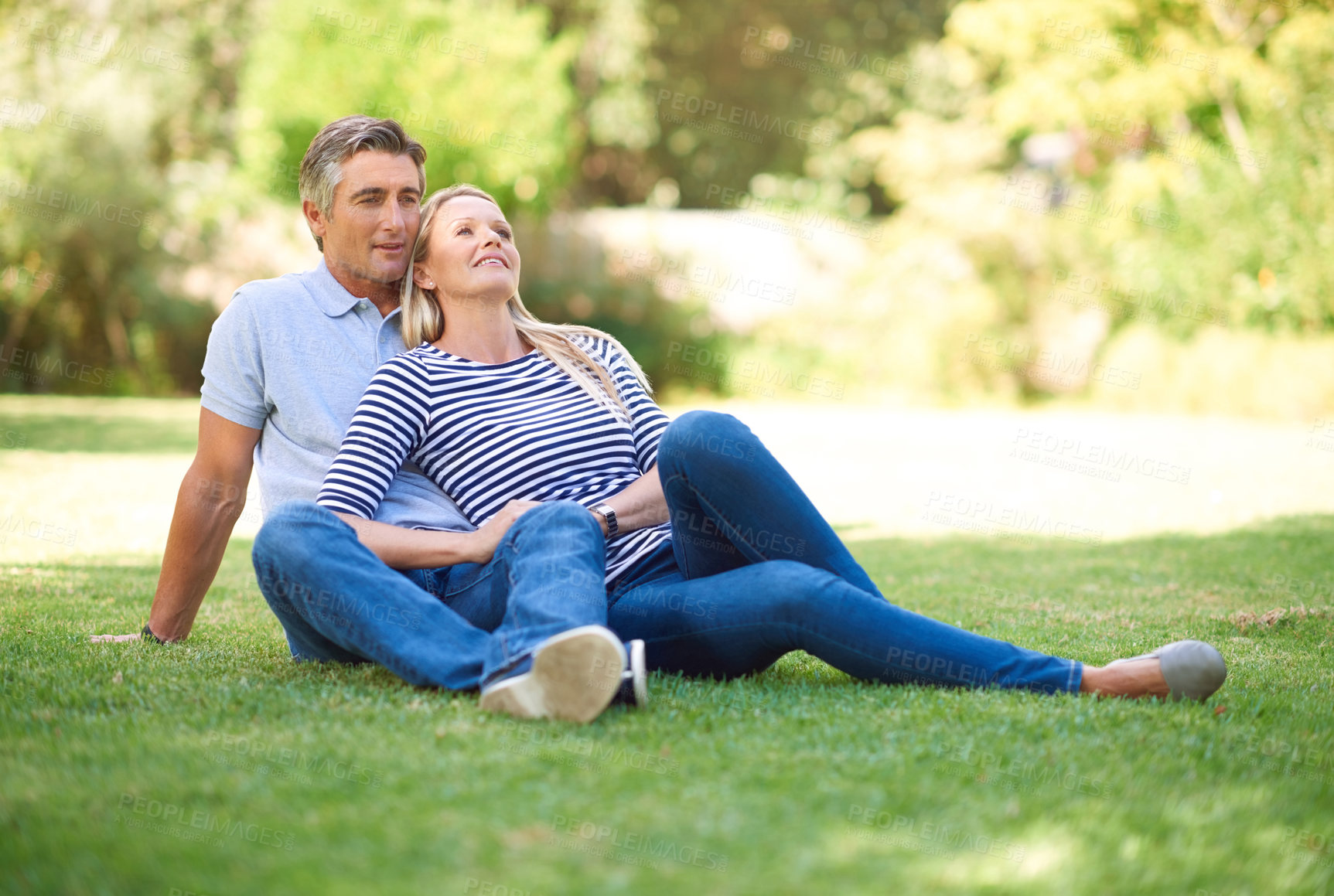 Buy stock photo Mature couple, smile and relax on grass for healthy marriage, love relationship and bonding in park. Happy man, woman and sitting on lawn for support, care and romantic time together in nature garden