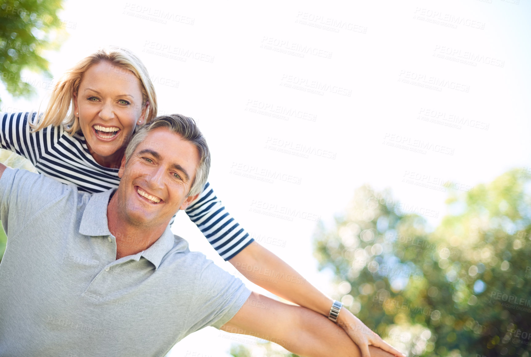 Buy stock photo Freedom, piggyback and portrait with couple in park together for anniversary, bonding or romance. Adventure, smile or travel with mature man and woman outdoor in nature for summer holiday or vacation