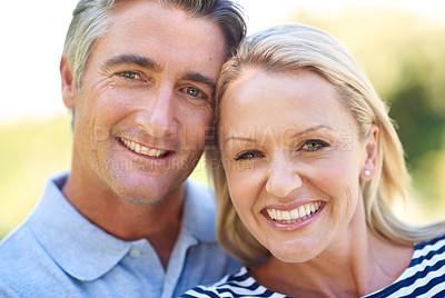 Buy stock photo Cropped portrait of a happy mature couple in the park