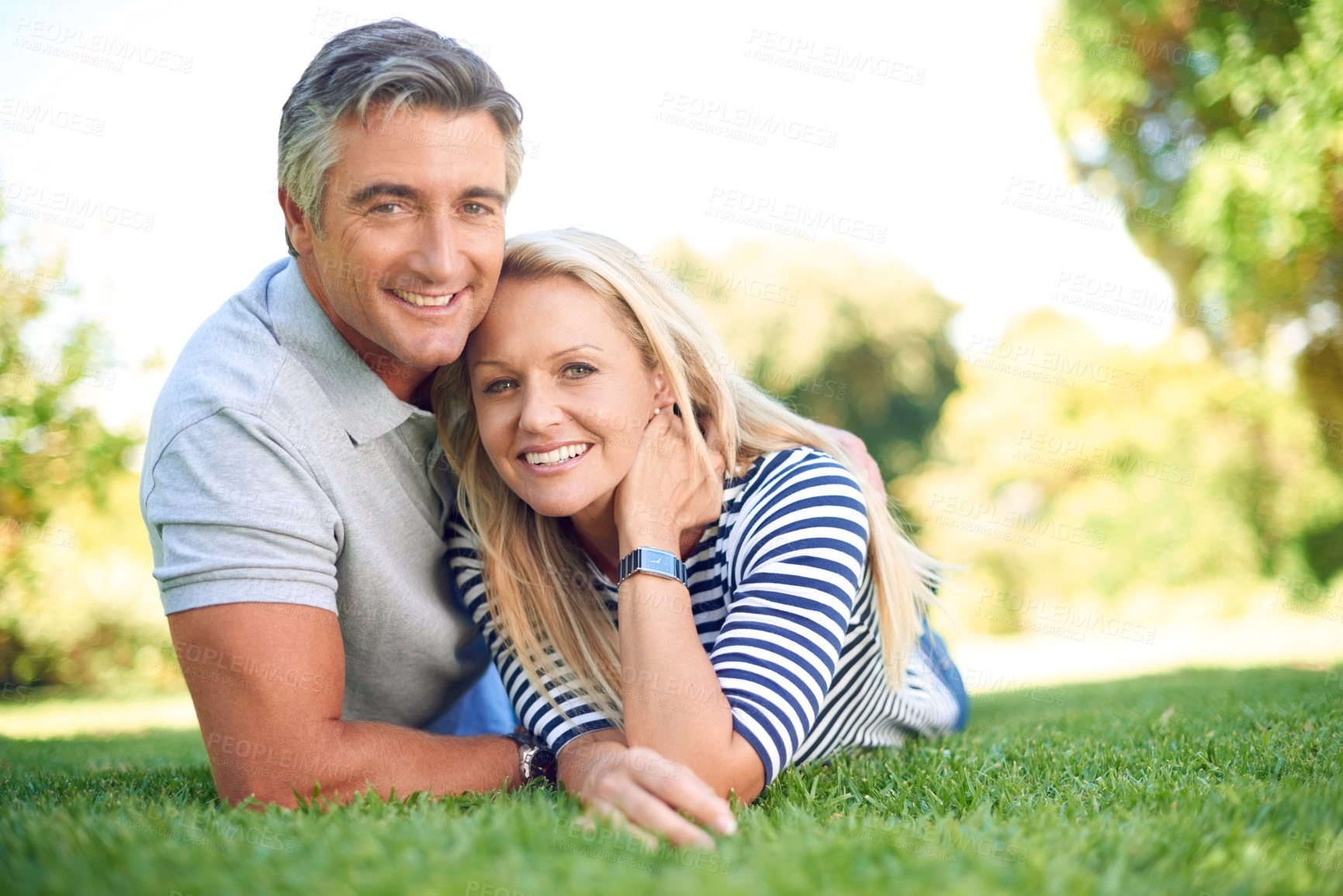 Buy stock photo Portrait, happy and mature couple on grass outdoor at park for love, care and romantic date. Face, man and woman relax on lawn for healthy relationship, connection and bonding together with partner