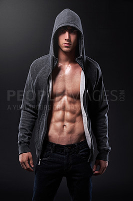 Buy stock photo Serious, athlete and portrait of man in studio for fitness, muscle and pride in healthy body. Male person, bodybuilder and hoodie with confidence on black background for sports, six pack and wellness