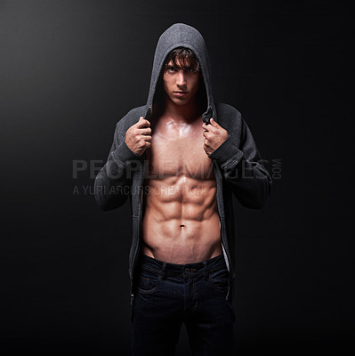 Buy stock photo Fitness, man and portrait of athlete in studio for healthy body, wellness and pride in six pack. Serious, bodybuilder and male person with confidence on black background for sports, hoodie and muscle