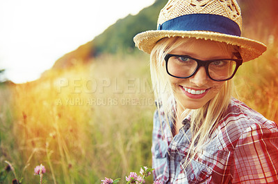 Buy stock photo Lens flare, countryside and portrait of happy woman in field for freedom, wellness and sustainability outdoor. Nature, summer and face of hipster person in meadow with glasses, fashion and style