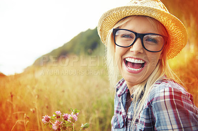 Buy stock photo Happy, countryside and face of woman laugh in field for freedom, wellness and fresh air outdoor. Nature, hipster and portrait of person in meadow with lens flare for relaxing and sustainability