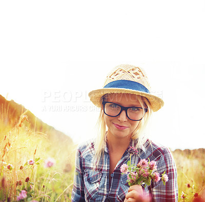 Buy stock photo Portrait, countryside and woman with flowers in field for freedom, wellness and fresh air outdoors. Nature, summer and hipster female person in natural meadow for relaxing, calm and peace in morning