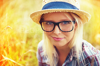 Buy stock photo Lens flare, nature and portrait of woman in countryside for freedom, wellness and fresh air outdoors. Hipster, summer and face of female person in meadow field for relaxing, calm and peace in morning