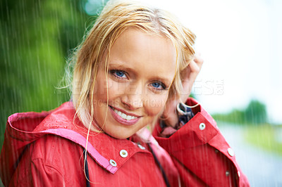 Buy stock photo Smile, portrait and young woman in the rain with coat in nature, road or street for winter. Happy, positive attitude and female person from Australia in drizzle or storm weather in outdoor forest.