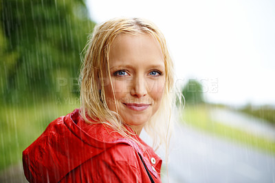 Buy stock photo Friendly, portrait and young woman in the rain with coat in nature, road or street for winter. Smile, positive attitude and female person from Australia in drizzle or storm weather in outdoor forest.