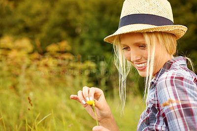 Buy stock photo Spring, countryside and woman picking flowers in field for freedom, wellness and fresh air outdoors. Nature, summer and happy hipster female person in meadow for relaxing, sustainability and ecology