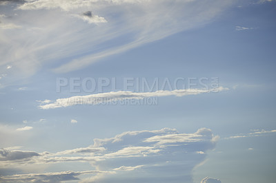 Buy stock photo Light clouds in a blue sky with copy space background. A beautiful clear summer sky with sunshine and a white soft textured cloudscape in nature. Calming skies clearing up on a sunny day