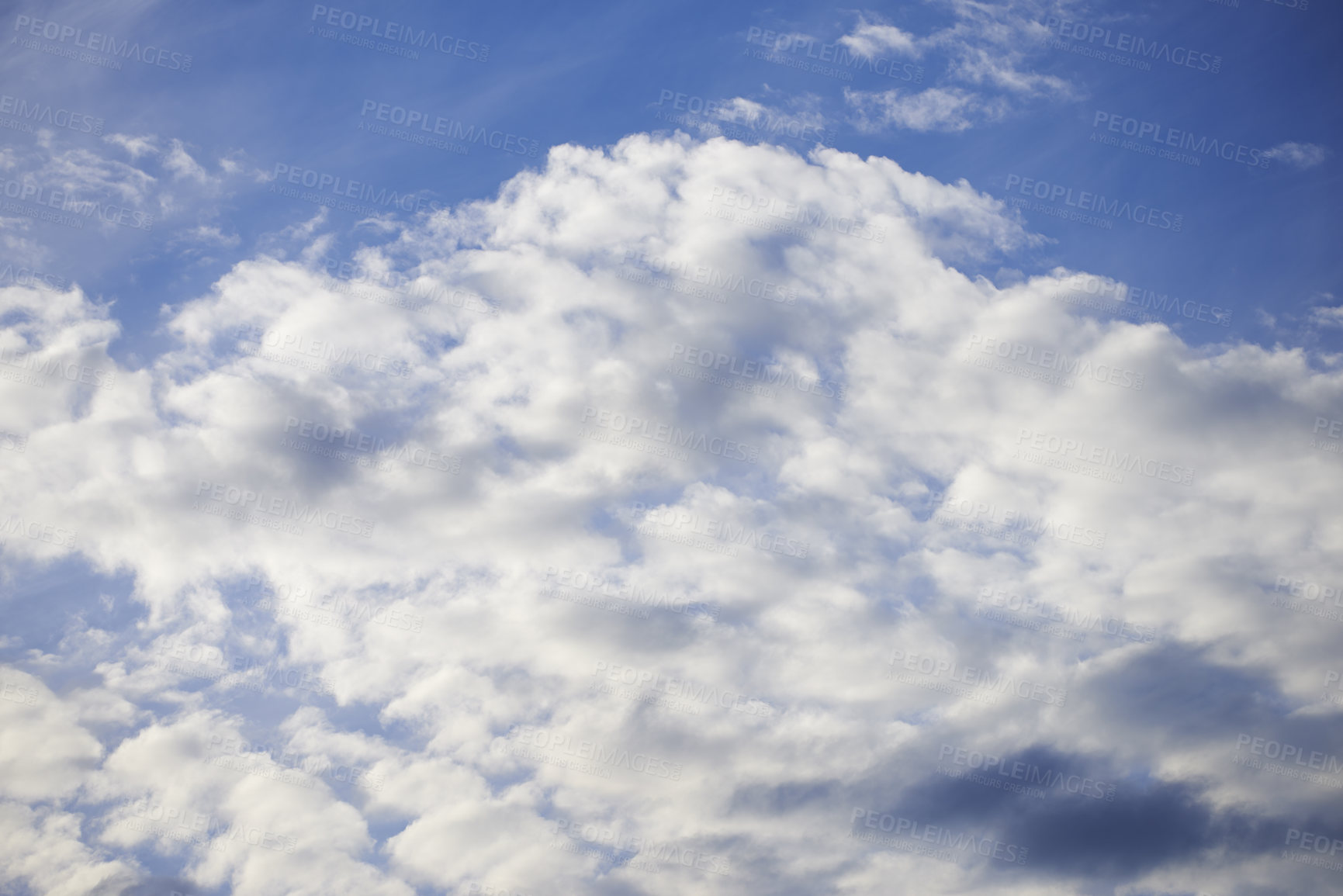 Buy stock photo Light clouds in a beautiful blue sky with copy space background. A beautiful clear summer sky with sunshine and a white soft textured cloudscape in nature. Calming skies clearing up on a sunny day