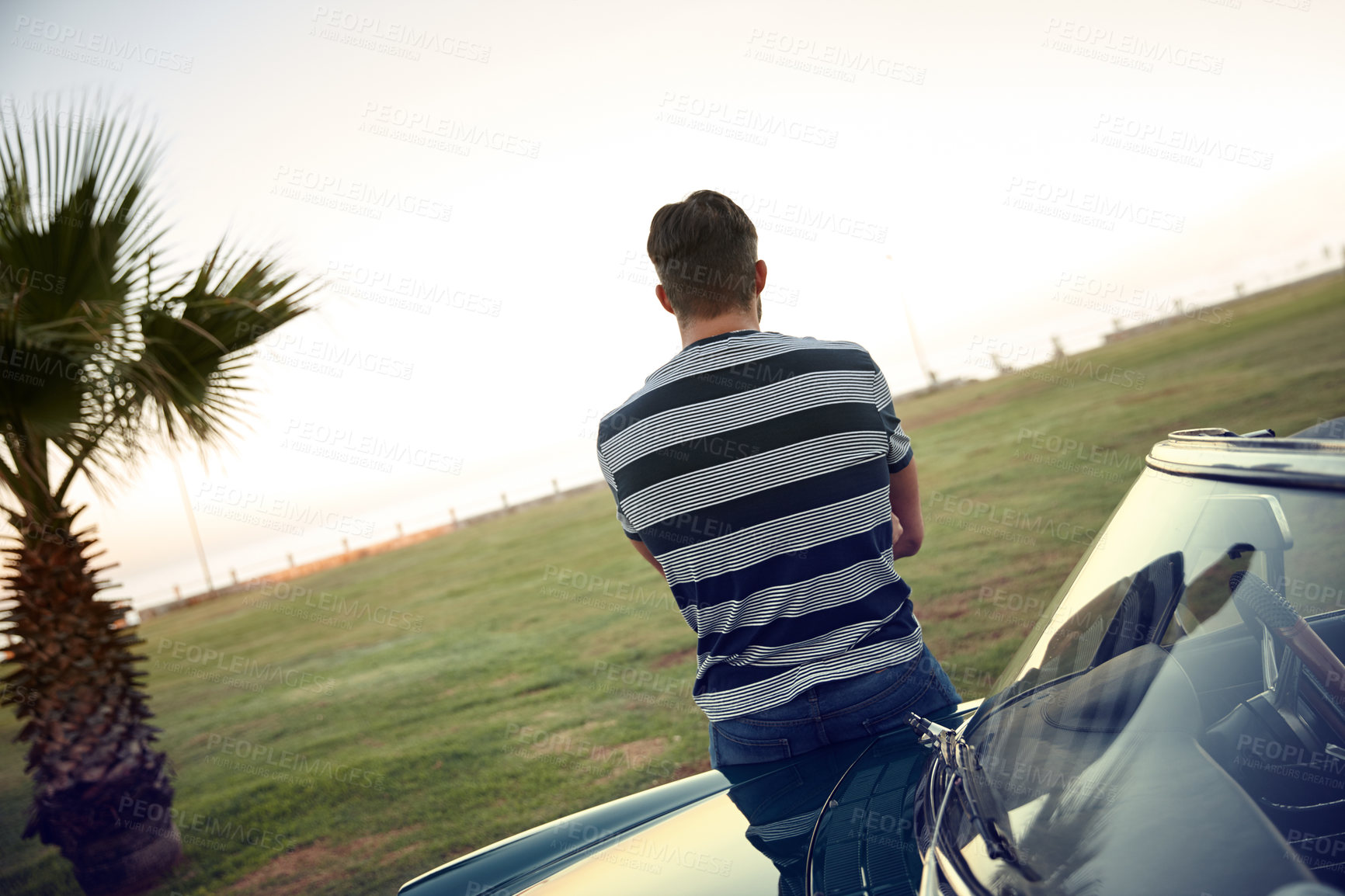 Buy stock photo Back, road trip and man in car in park for solo holiday, outdoor travel and vacation to relax. Driver, transport or male person in motor vehicle thinking of adventure ideas, journey and weekend break