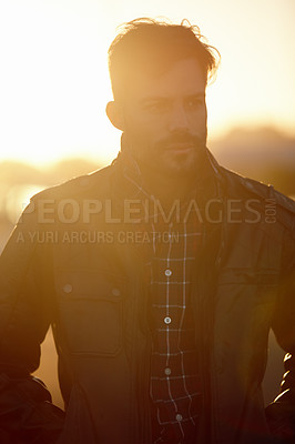 Buy stock photo Cropped shot of a handsome young man outdoors