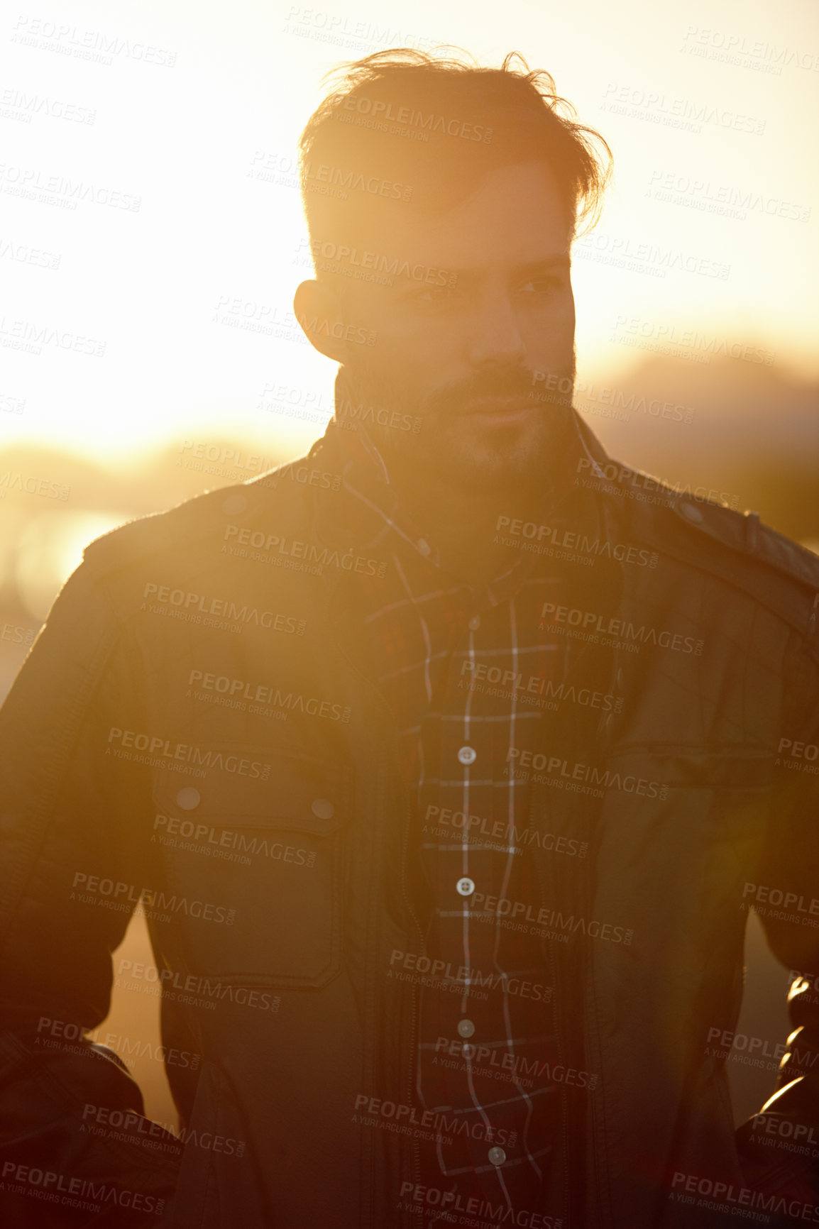 Buy stock photo Cropped shot of a handsome young man outdoors