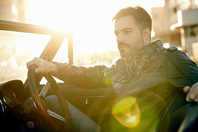 Buy stock photo Shot of a young man on a roadtrip