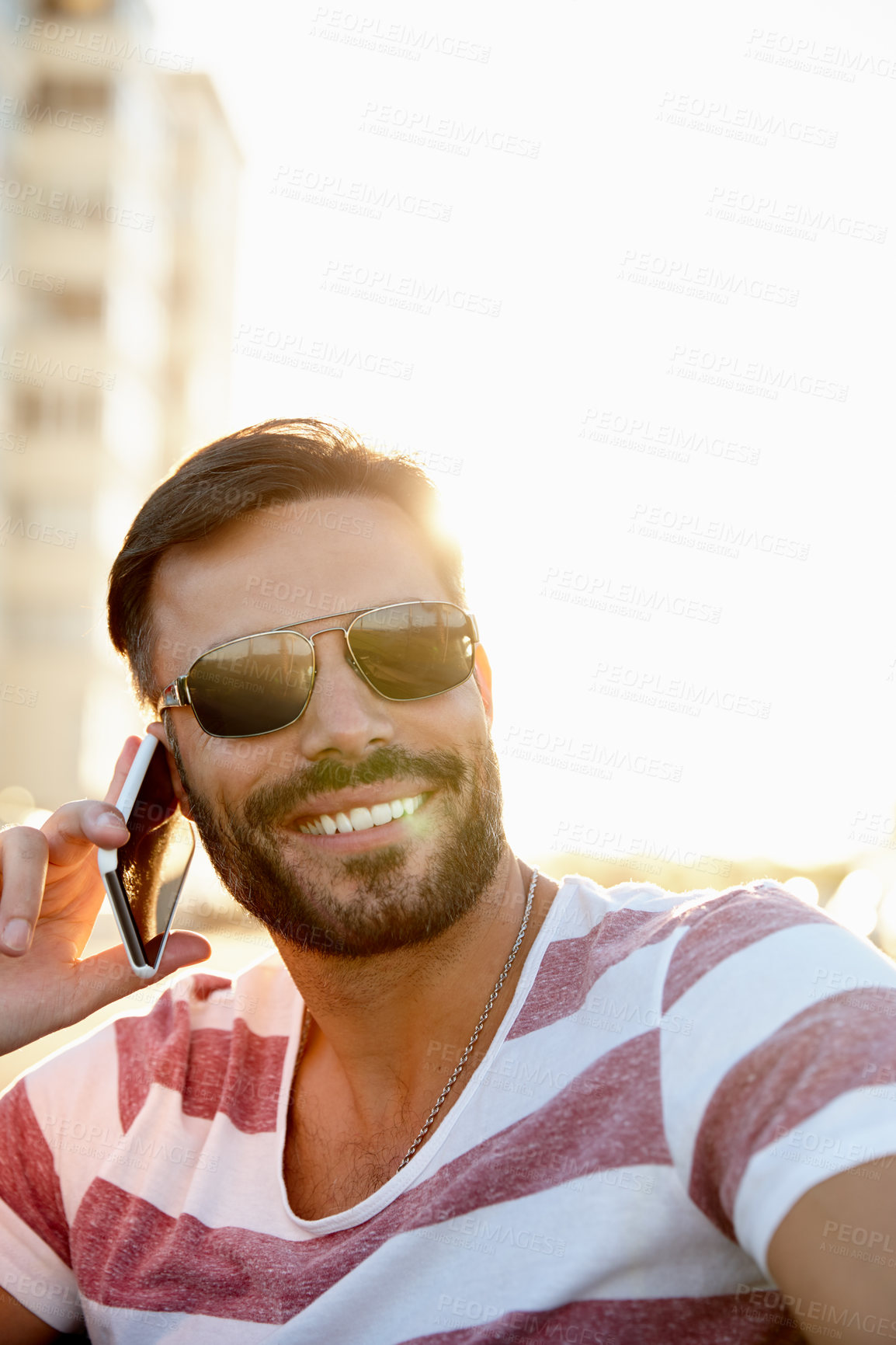 Buy stock photo Cropped shot of a handsome young man outdoors