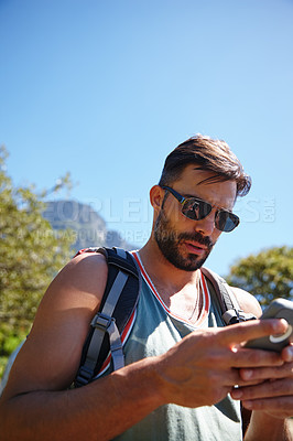 Buy stock photo A hiker with a backpack on his back