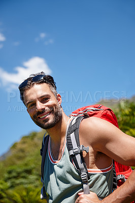 Buy stock photo A hiker with a backpack on his back