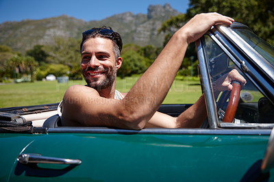 Buy stock photo Shot of a handsome young man on a roadtrip