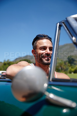 Buy stock photo Shot of a young man on a roadtrip