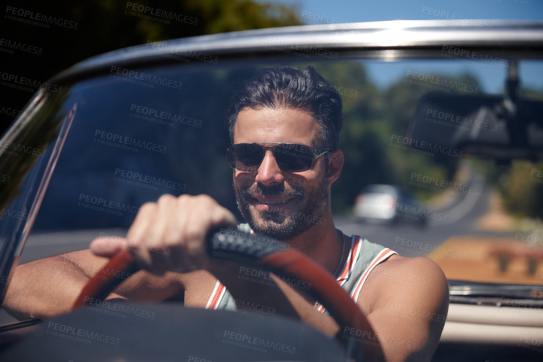 Buy stock photo Shot of a handsome young man on a roadtrip