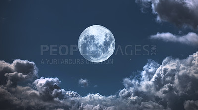 Buy stock photo A photo of the moon surrounded by friendly clouds