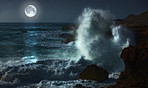 Moonshine over stormy ocean