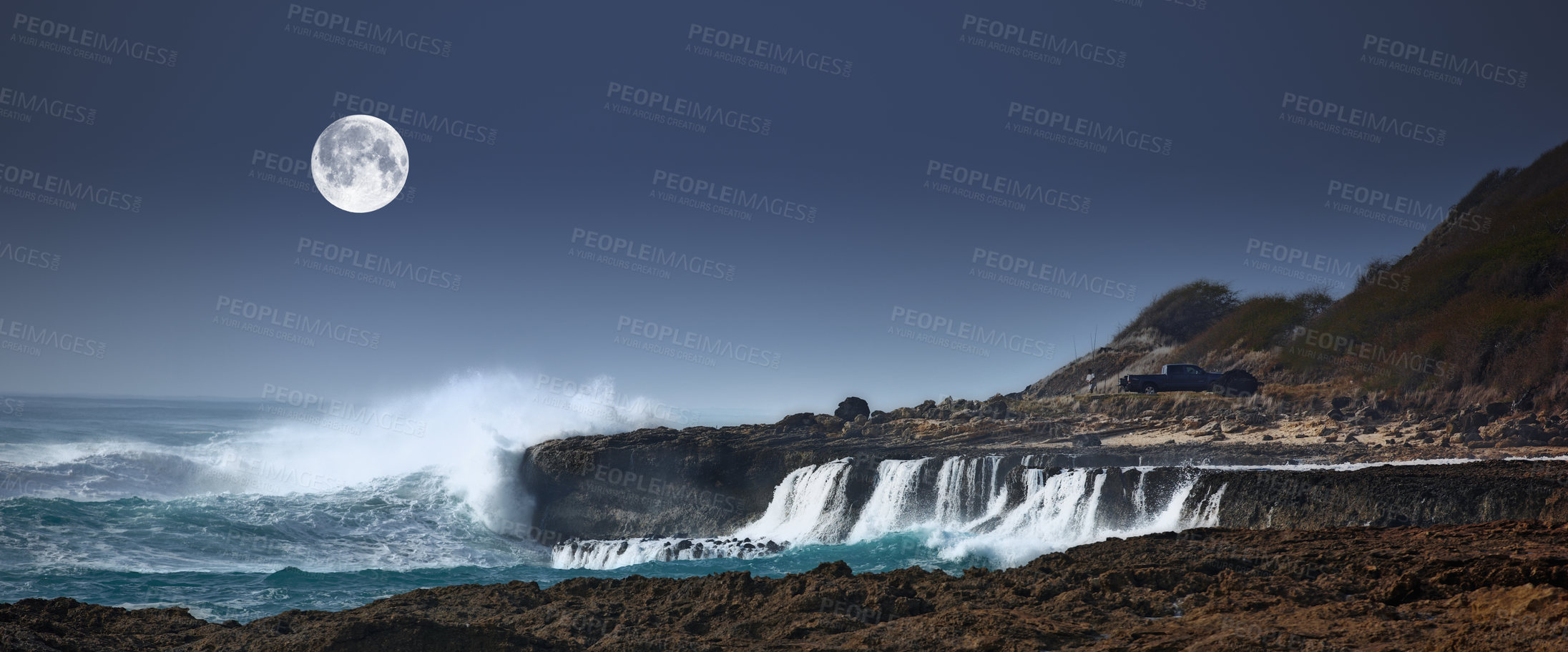 Buy stock photo Dark, moon and waves in ocean for landscape, natural beauty or peace with environment. Night, sea and rocky coastline with planet glow or energy in summer, water storm on vacation in Mauritius