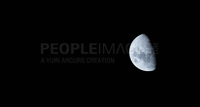 Buy stock photo Close up of the half moon isolated against a came and peaceful black sky during midnight. A calm peaceful night of a brightly lit round sphere planet in the dark sky in a black galaxy or universe