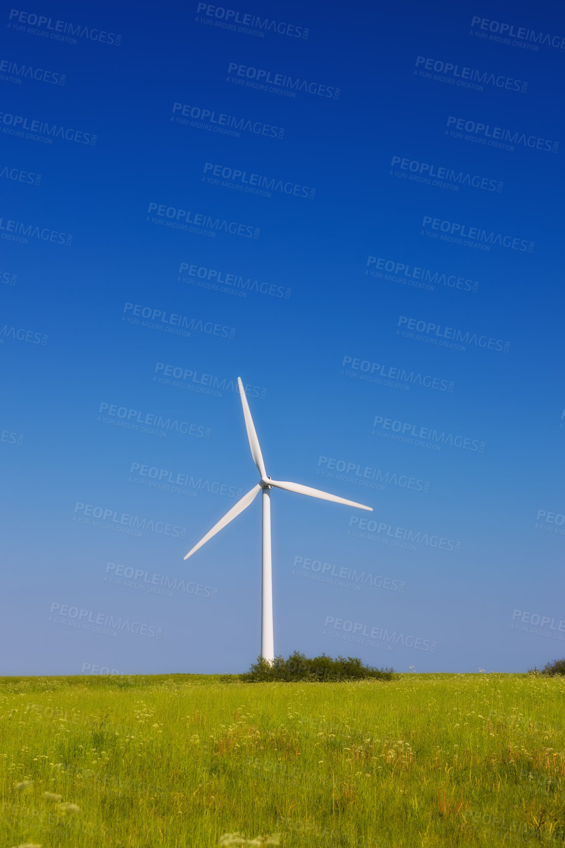 Buy stock photo Field, nature and windmill with isolated, blue sky and green energy with economic generator. Abstract, natural electricity and grass landscape for alternative power, wallpaper and eco friendly farm