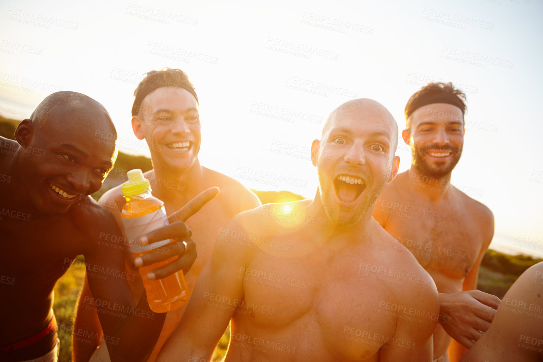 Buy stock photo Portrait of a group of sporty male friends enjoying time in the outdoors
