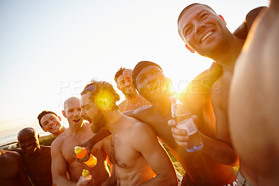 Buy stock photo Shot of a group of sporty male friends enjoying time in the outdoors