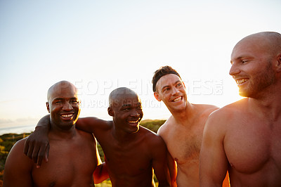 Buy stock photo Shot of a group of sporty male friends enjoying time in the outdoors
