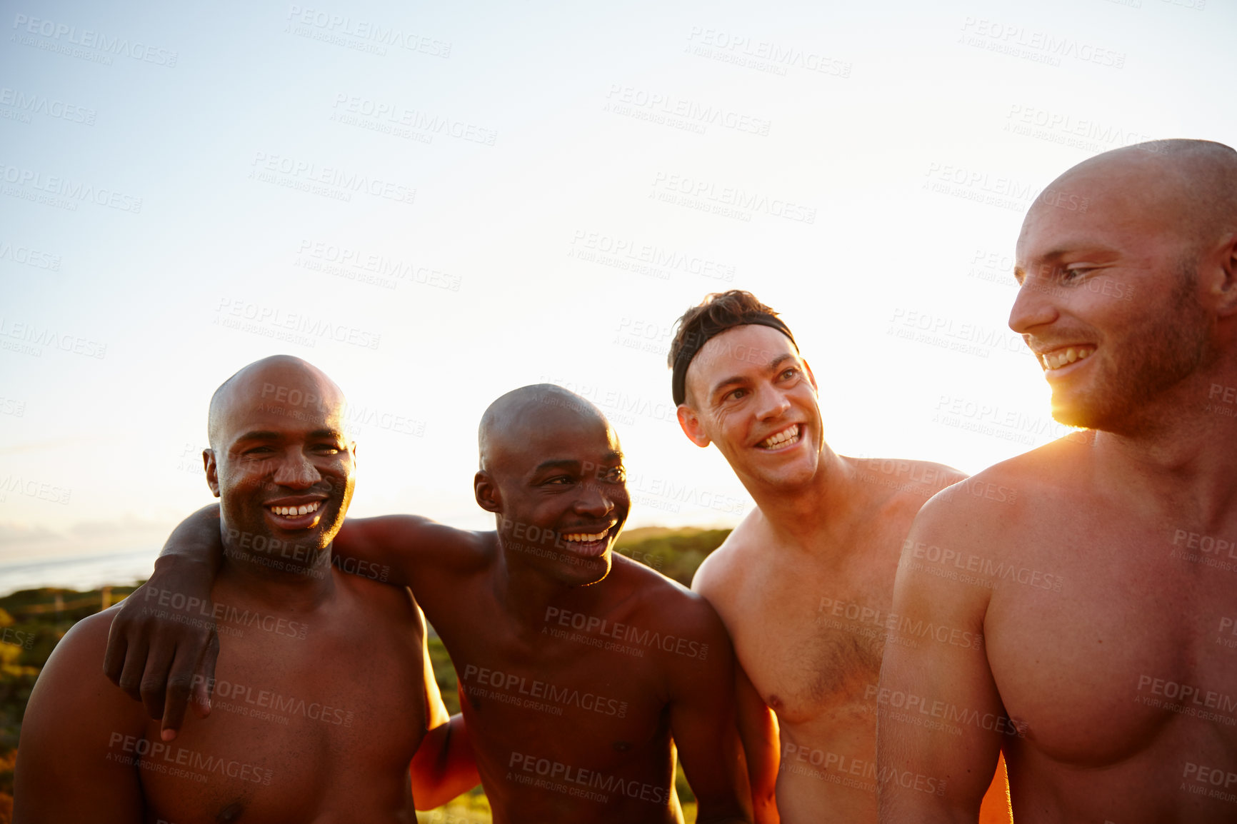 Buy stock photo Excited, smile and team at beach with group in sports training, exercise or fitness workout. Friends, bonding and happy men in nature with sunset, confidence and fun game for wellness and joy