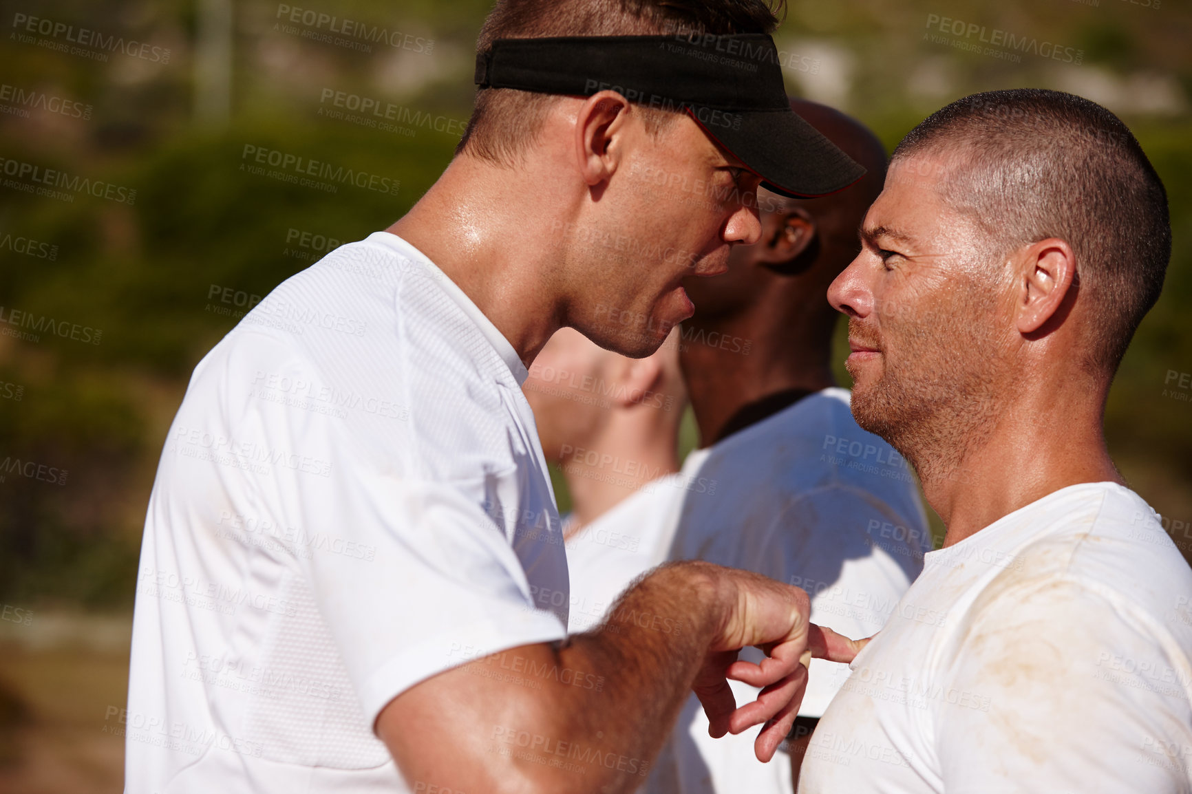 Buy stock photo Shot of a man being shouted at by the training officer at a military bootcamp