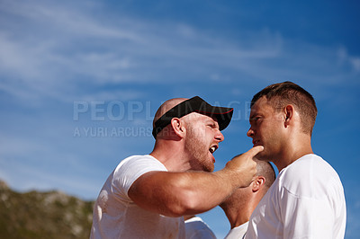 Buy stock photo Shot of a man being shouted at by the training officer at a military bootcamp