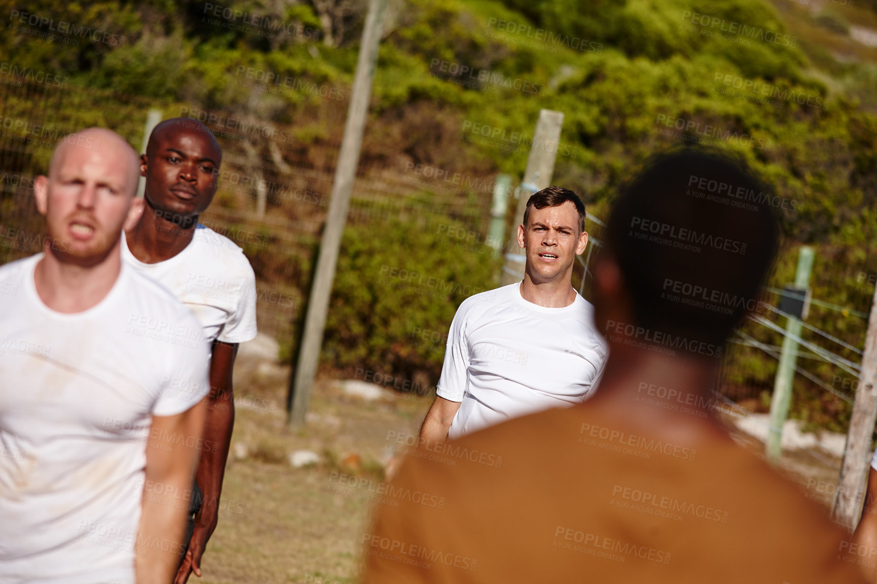 Buy stock photo Shot of a group of men doing exercises at a military bootcamp