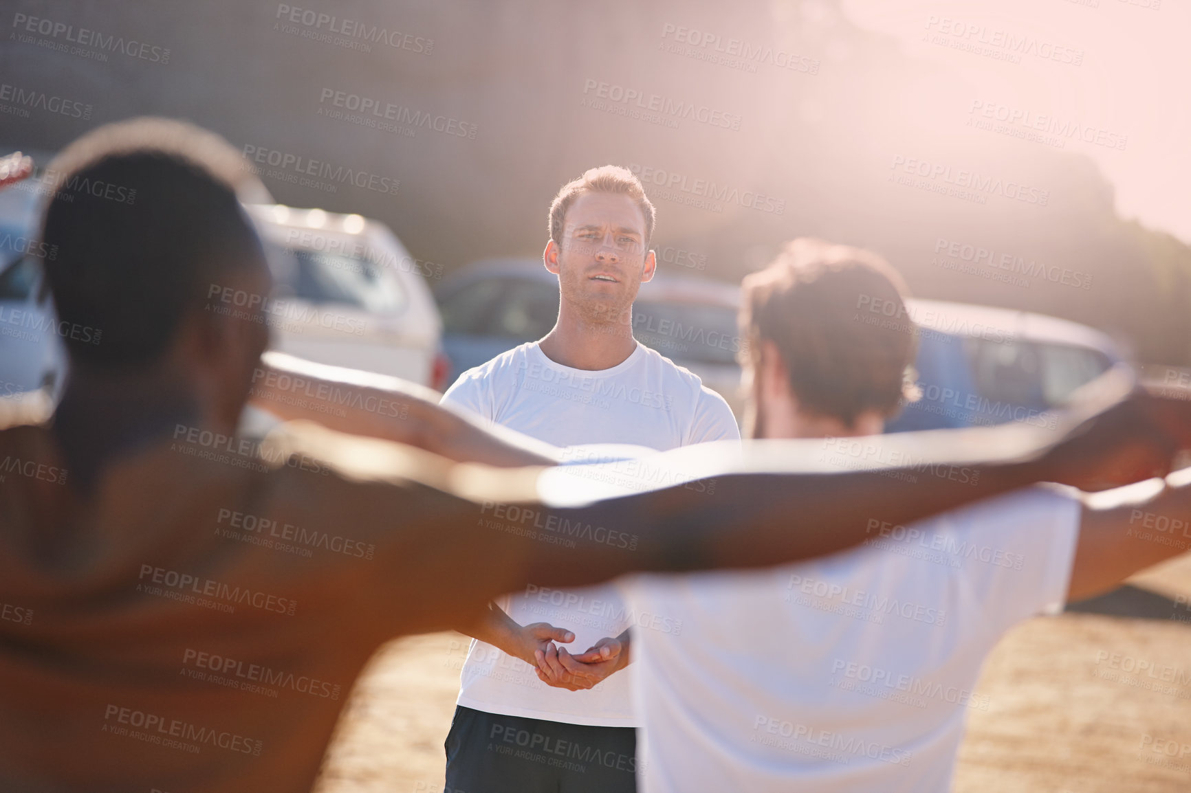 Buy stock photo Outdoor, coach and people with stretching for fitness, physical activity and wellness in military. Bootcamp, army men and soldiers with instructor for jumping jacks, workout and training for stamina