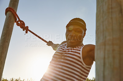 Buy stock photo Portrait of a man going through an obstacle course at a military bootcamp