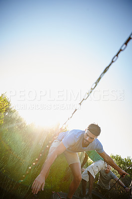 Buy stock photo Shot of a man walking across an obstacle at bootcamp