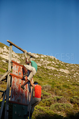 Buy stock photo Fitness, rope and people climbing wall for training, endurance exercise and bootcamp challenge. Military barrier, men and physical test for outdoor workout, obstacles course and strength assessment