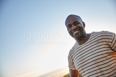 Buy stock photo Portrait of a smiling man standing in the outdoors