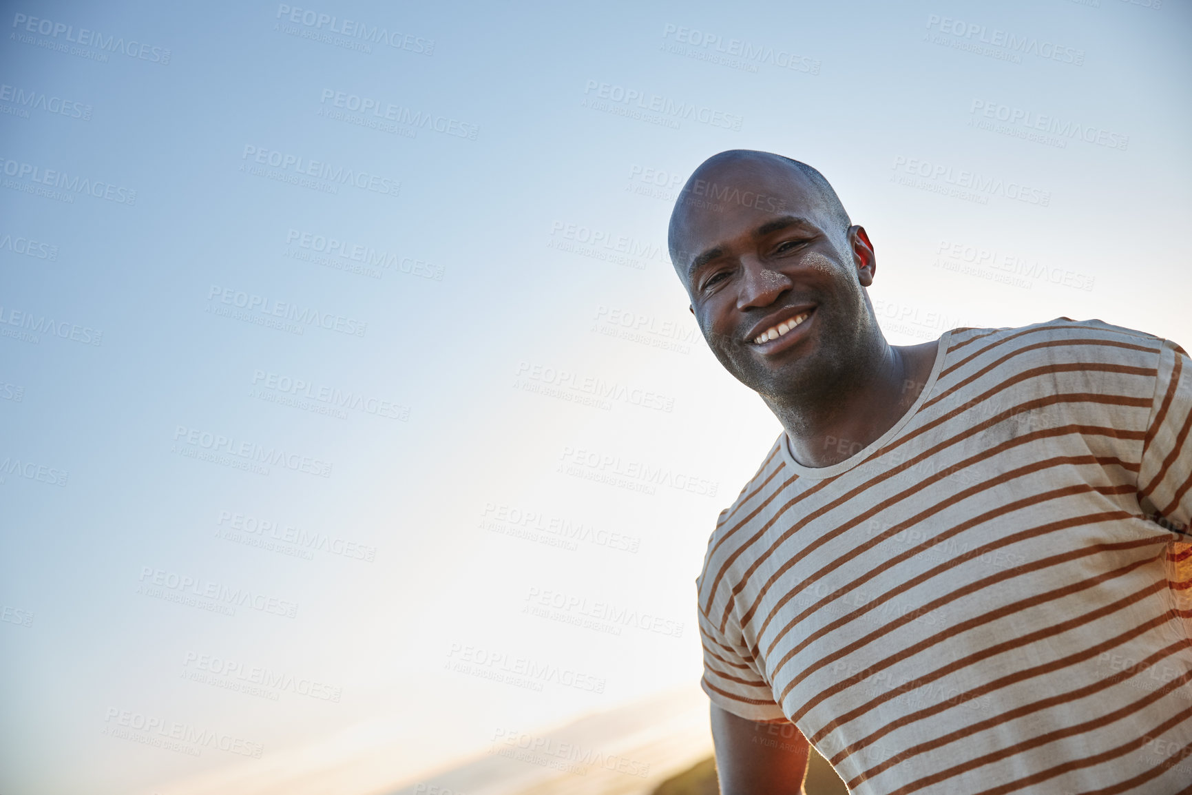 Buy stock photo Portrait of a smiling man standing in the outdoors