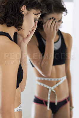Buy stock photo Measuring tape, woman and stress from diet, anorexia problem and upset mental health. Mirror, body and sad female person with eating disorder unhappy about reflection, weight and stomach measurements
