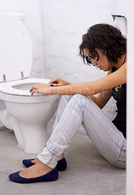 Buy stock photo Bathroom, sick and woman on a floor suffering from anorexia, depression or anxiety. Stress, toilet and female with body dysmorphia, bulimia or an eating disorder, nausea and mental health problem