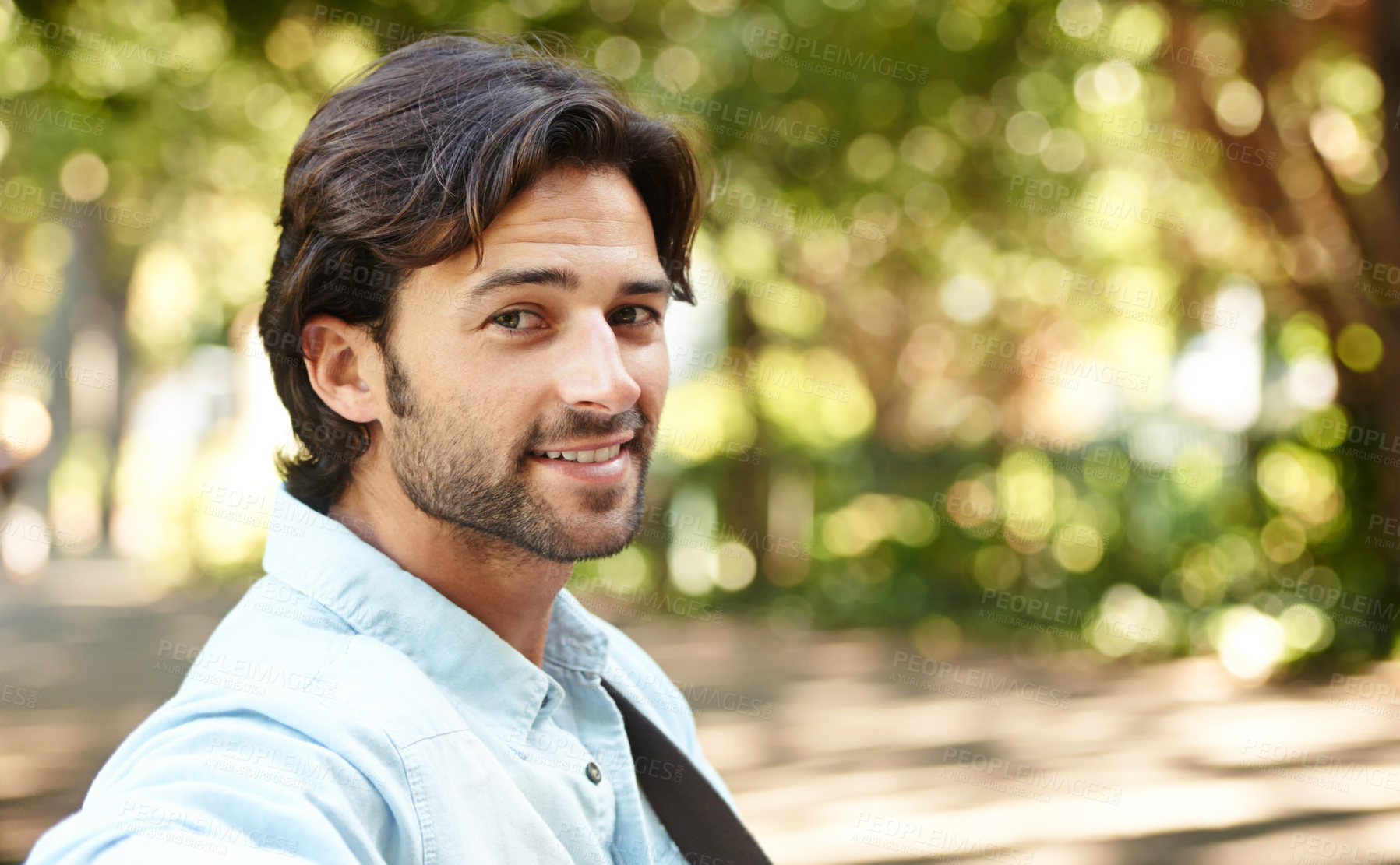 Buy stock photo Relax, portrait or happy man in nature on a bench in summer for holiday vacation or break in garden. Freedom, smile or face of person in park resting or waiting in a natural environment for wellness
