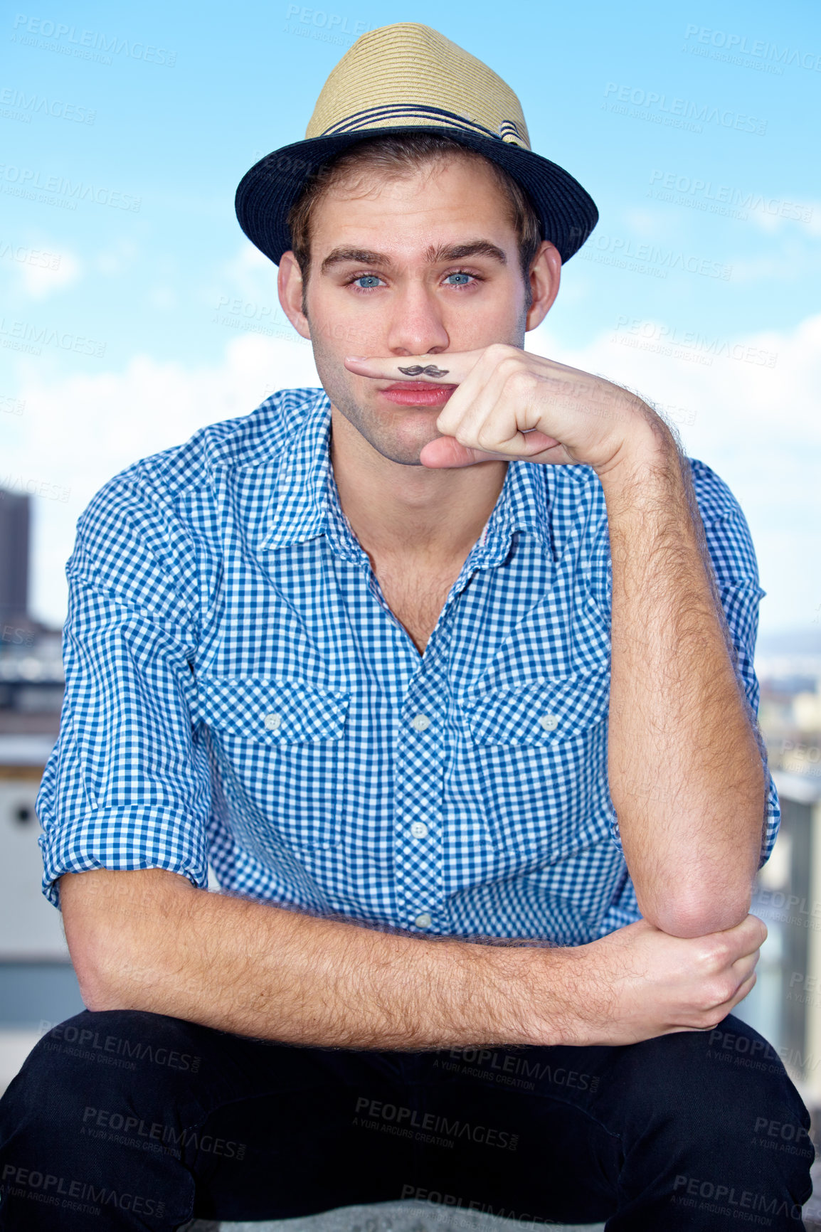 Buy stock photo Portrait of a handsome hipster with a finger mustache