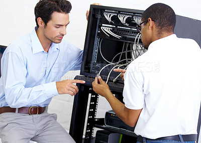 Buy stock photo Cables, programming and men with server. talking and cyber security in the workplace. Male employees, coworkers and staff with coding, electrician and technician with communication and tech support