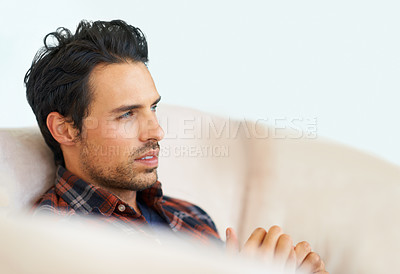 Buy stock photo Man, thinking or serious on sofa for ideas, question and calm expression in living room of apartment or home. Person, face and confidence or thoughtful on couch in lounge for chill or rest on weekend